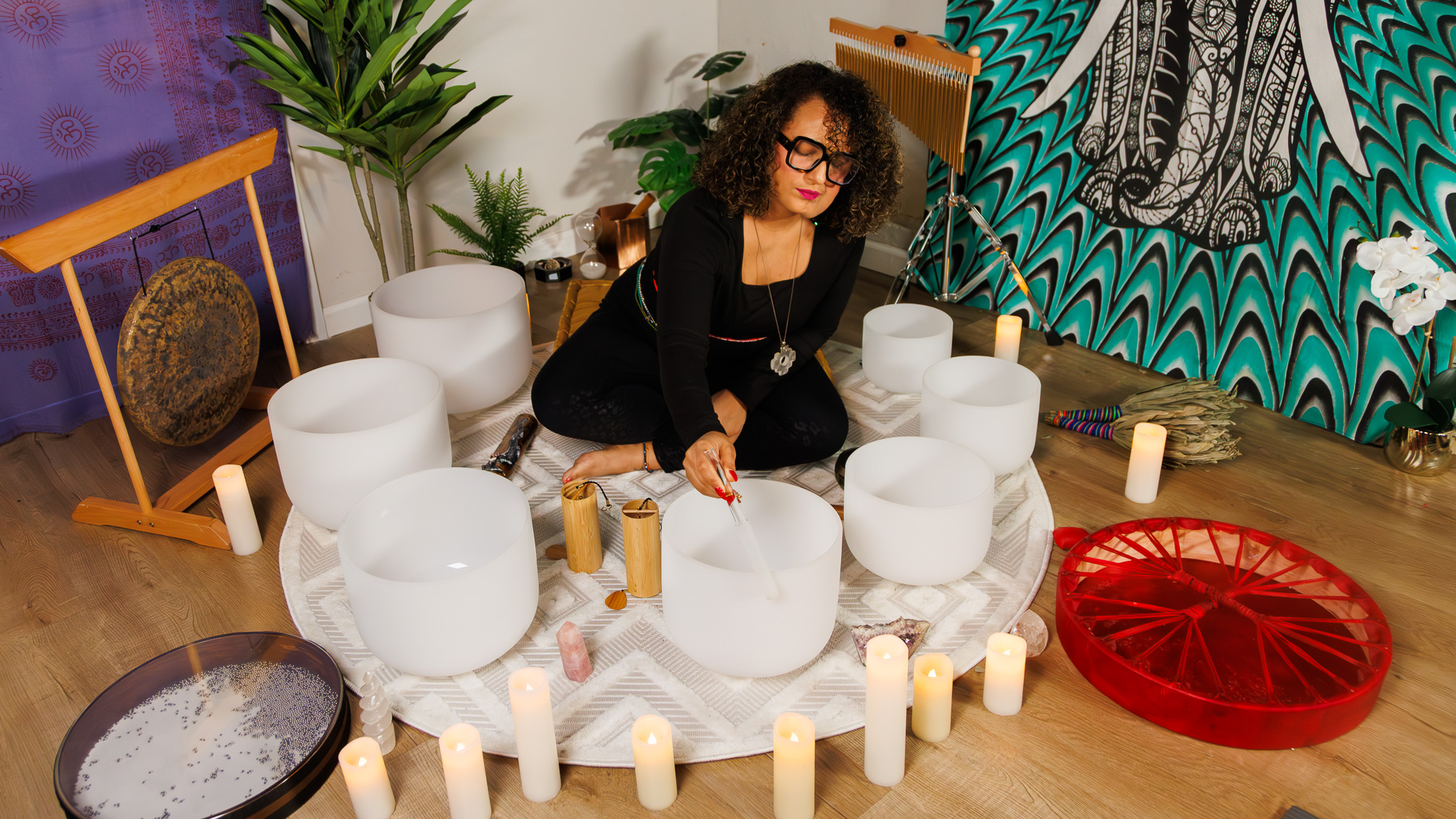 Dr. Sharon GE Washington playing frosted crystal singing bowls during a Guided Grounding sound immersion